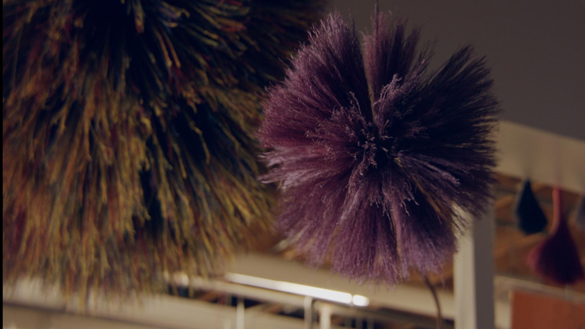 It’s a unique object created by Berea College Student Craft in collaboration with internationally known designer Stephen Burks. A large sphere made of approximately 1,500 pieces of broomcorn, sometimes dyed in a variety of colors, the piece is meant to celebrate the creative power of the Berea College student. It’s a piece of art called “Broom Thing.”